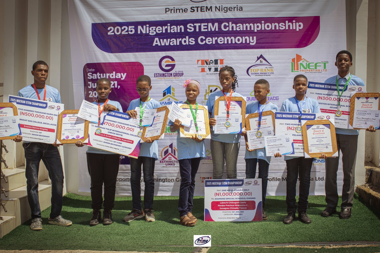 2025 Nigerian STEM Championship Winners with ceremonial cheques on stage